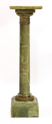 Lot 495 - An onyx and gilt-mounted column