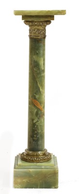 Lot 495 - An onyx and gilt-mounted column