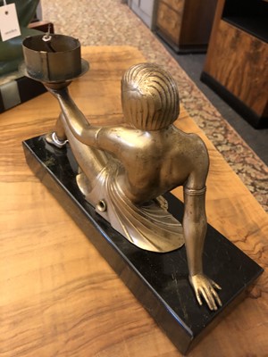 Lot 352 - An Art Deco patinated spelter figure of a girl