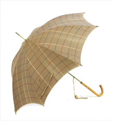 Lot 1097 - A Burberry mackintosh and umbrella