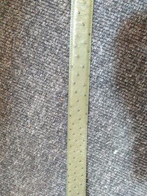 Lot 1140 - A Pickett of London gentleman's green ostrich leather belt