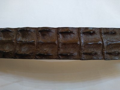 Lot 1141 - A Pickett of London gentleman's brown hornback crocodile belt