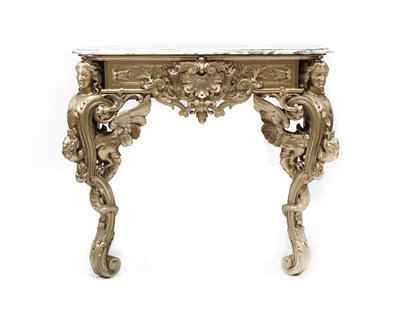 Lot 547 - A carved and gilt marble topped console table