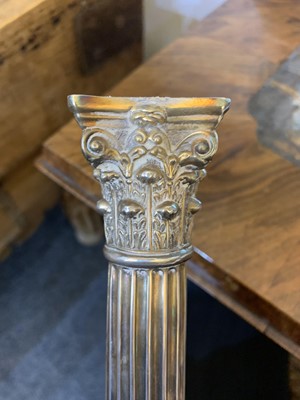 Lot 62 - A pair of Victorian silver Corinthian column candlesticks