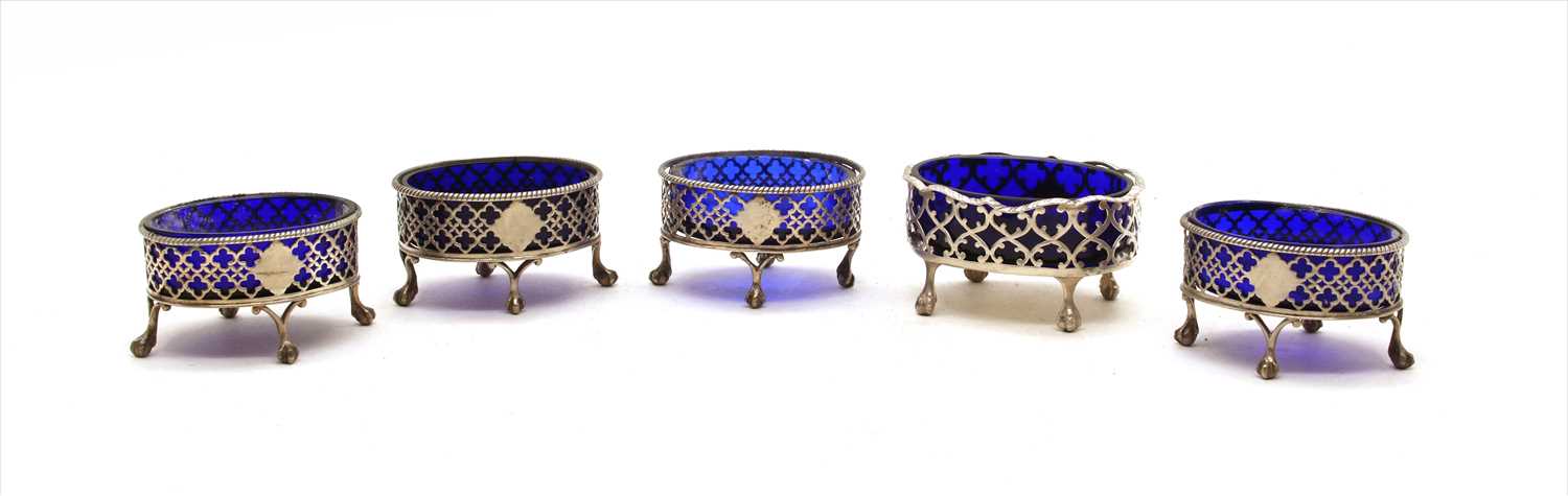 Lot 142 - Four George III silver salts with blue glass liners