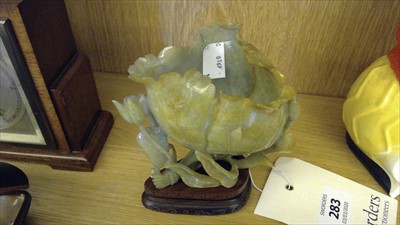 Lot 283 - A Chinese carved jadeite lotus vase