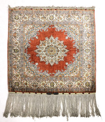Lot 505 - A small silk Hereke rug