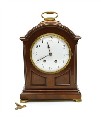 Lot 420 - An Edwardian mahogany and gilt mantle clock