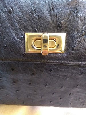 Lot 273 - A Pickett of London black ostrich leather mini handbag