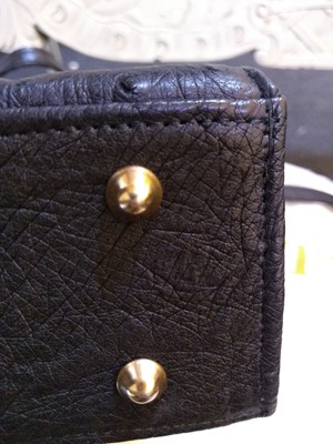 Lot 273 - A Pickett of London black ostrich leather mini handbag