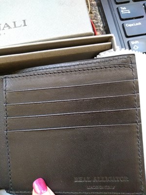Lot 250 - A Canali black alligator leather billfold wallet