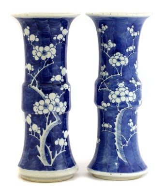 Lot 421 - A pair of Chinese blue and white gu vases