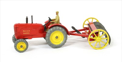 Lot 168 - A Dinky Toys farm tractor and hay rake