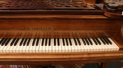 Lot 501 - A Bechstein mahogany boudoir grand piano