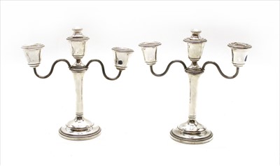 Lot 185 - A pair of modern silver twin branch candelabra