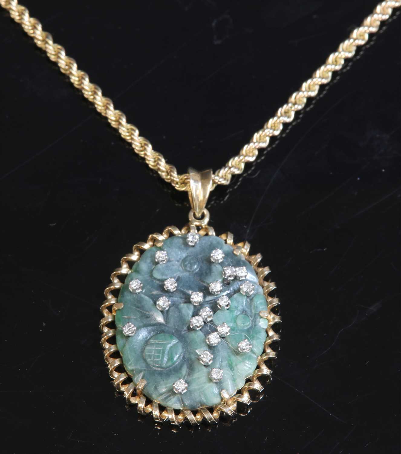 Lot 151 - A Continental jade and diamond pendant