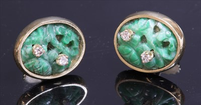 Lot 152 - A pair of Continental carved jade and diamond gold earrings