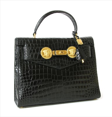 Lot 272 - A Gianni Versace black patent leather crocodile embossed handbag