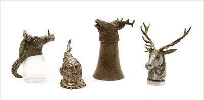 Lot 208 - Two metal stirrup cups, as a stag and wild boar