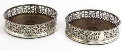 Lot 12 - A pair of George III silver wine coasters