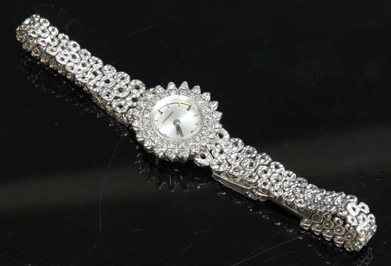 Lot 160 - A ladies' 18ct white gold Longines diamond set mechanical bracelet watch, c.1970