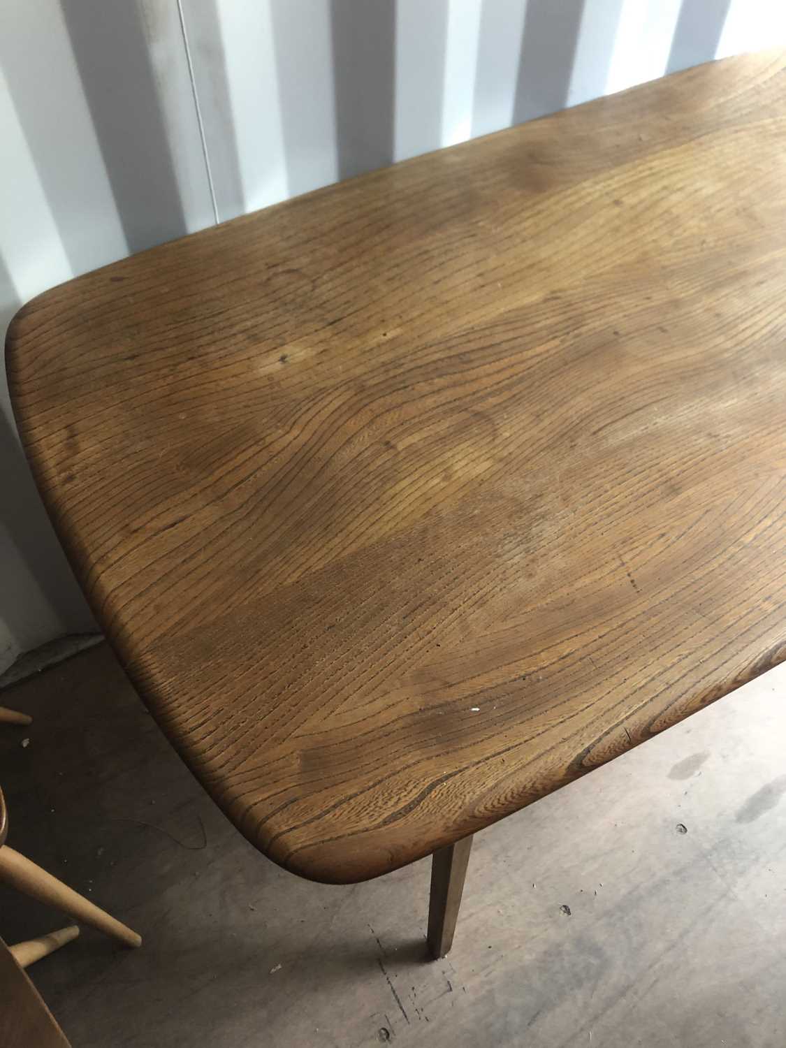Lot 74 An Ercol dining table,