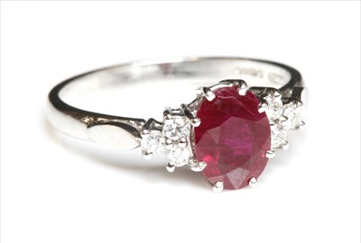Lot 250 - An 18ct white gold ruby and diamond seven stone ring