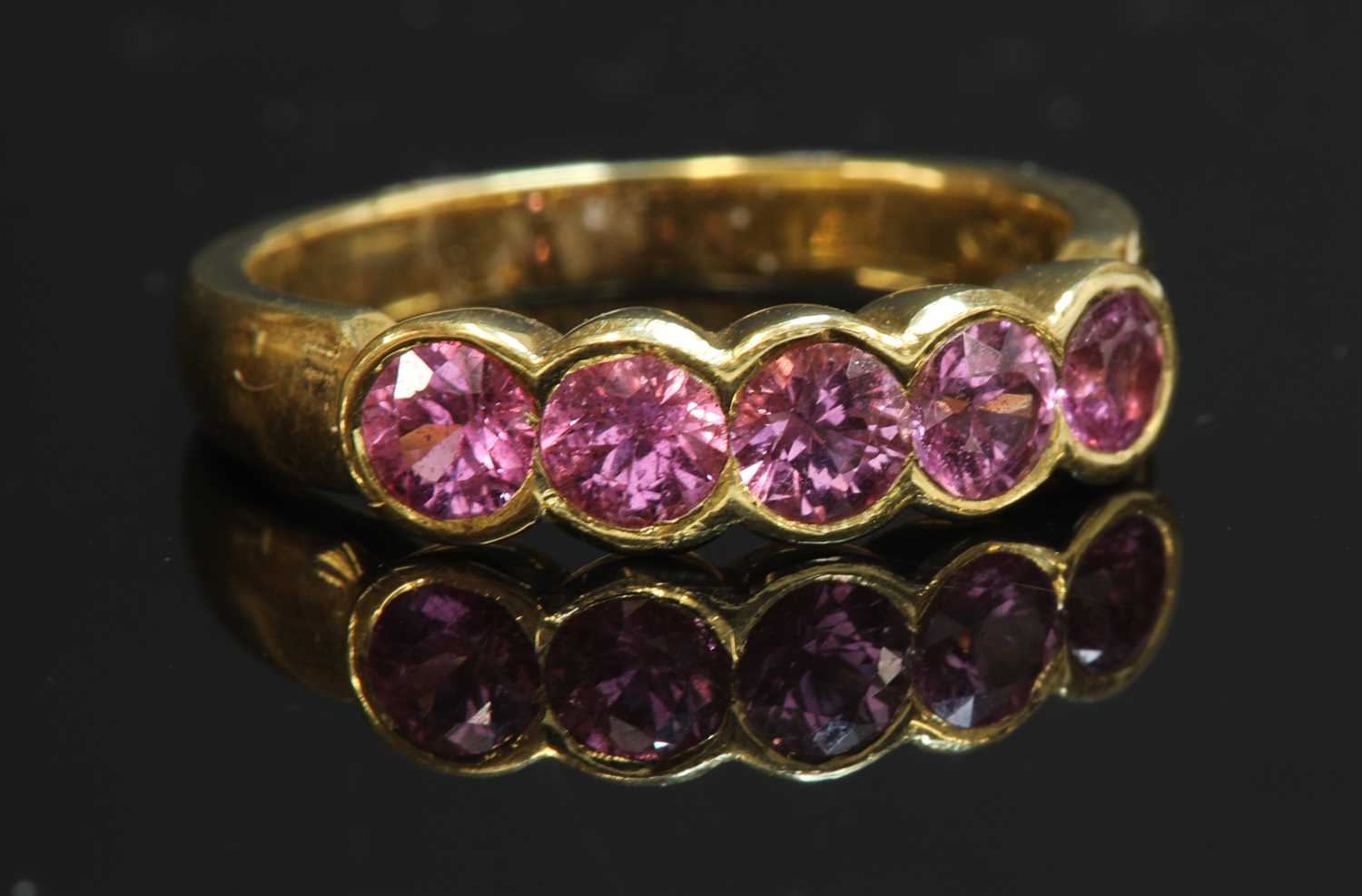 Lot 218 - An 18ct gold five stone pink sapphire ring
