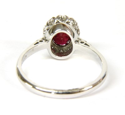 Lot 49 - An 18ct gold ruby and diamond cluster ring