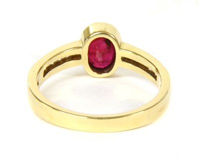 Lot 64 - An 18ct gold ruby and diamond ring