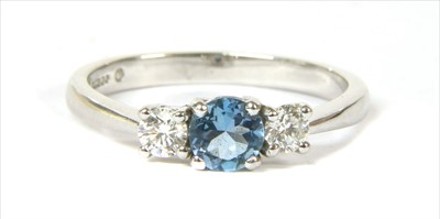 Lot 126 - An 18ct white gold three stone aquamarine and diamond ring