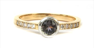 Lot 136 - An 18ct gold colour change sapphire and diamond ring
