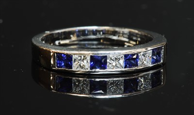 Lot 201 - An 18ct white gold sapphire and diamond half eternity ring