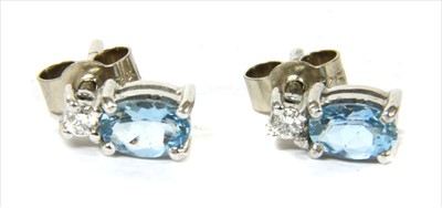 Lot 123 - A pair of 18ct white gold aquamarine and diamond earrings