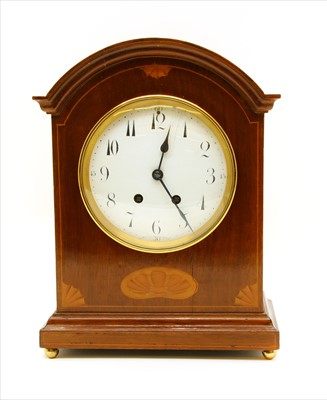 Lot 383 - An inlaid mahogany striking mantle clock