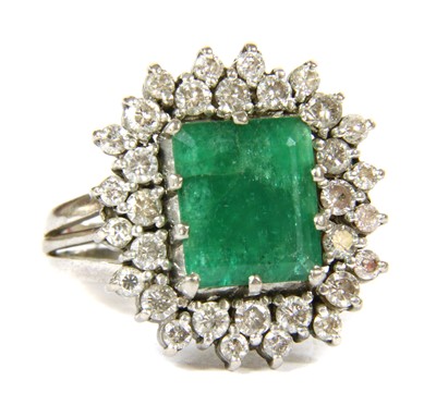 Lot 36 - An 18ct gold emerald and diamond rectangular cluster ring, c.1970