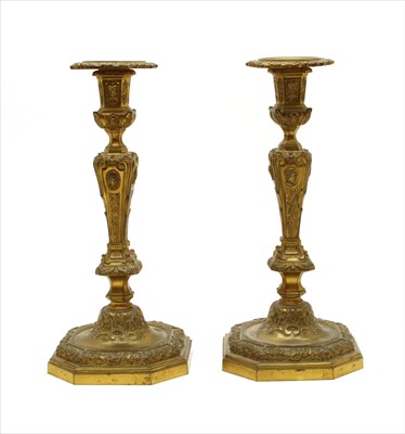 Lot 390 - A pair of French ormolu candlesticks