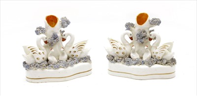 Lot 276 - A pair of Staffordshire swan spill vases