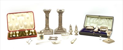 Lot 45 - A pair of silver Corinthian column candlesticks