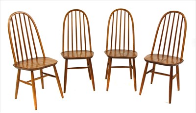 Lot 669 - Four Ercol elm hoop backed dining chairs