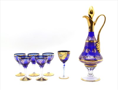 Lot 308 - A gilt decorated blue and clear glass ewer