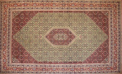 Lot 610 - An Islamic carpet of pattern and colour