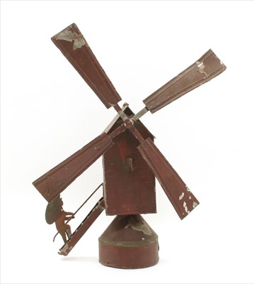 Lot 403 - A toleware whirligig windmill