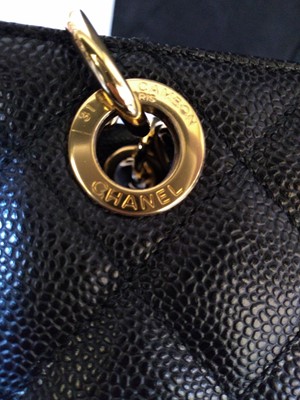 Lot 261 - A Chanel black caviar petit tote