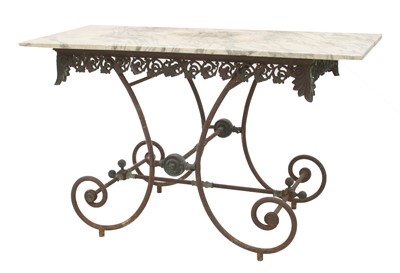 Lot 121 - A wrought iron and brass garden or arbour table
