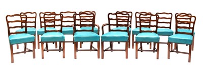 Lot 537 - A set of fourteen George II-style mahogany dining chairs