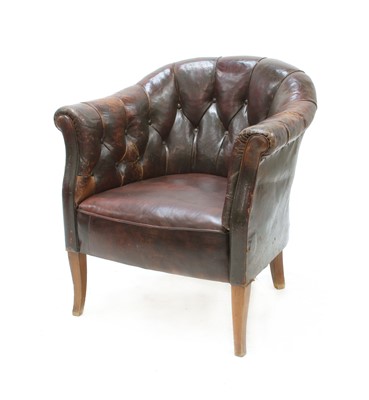 Lot 491 - A 19th century brown buttoned leather tub armchair