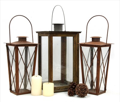 Lot 1242 - A pair of antique style rusted terrace lanterns, and a large garden lantern