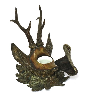 Lot 258 - A Viennese cold painted bronze stag's head inkwell