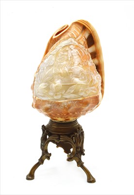 Lot 408 - A carved conch shell lamp